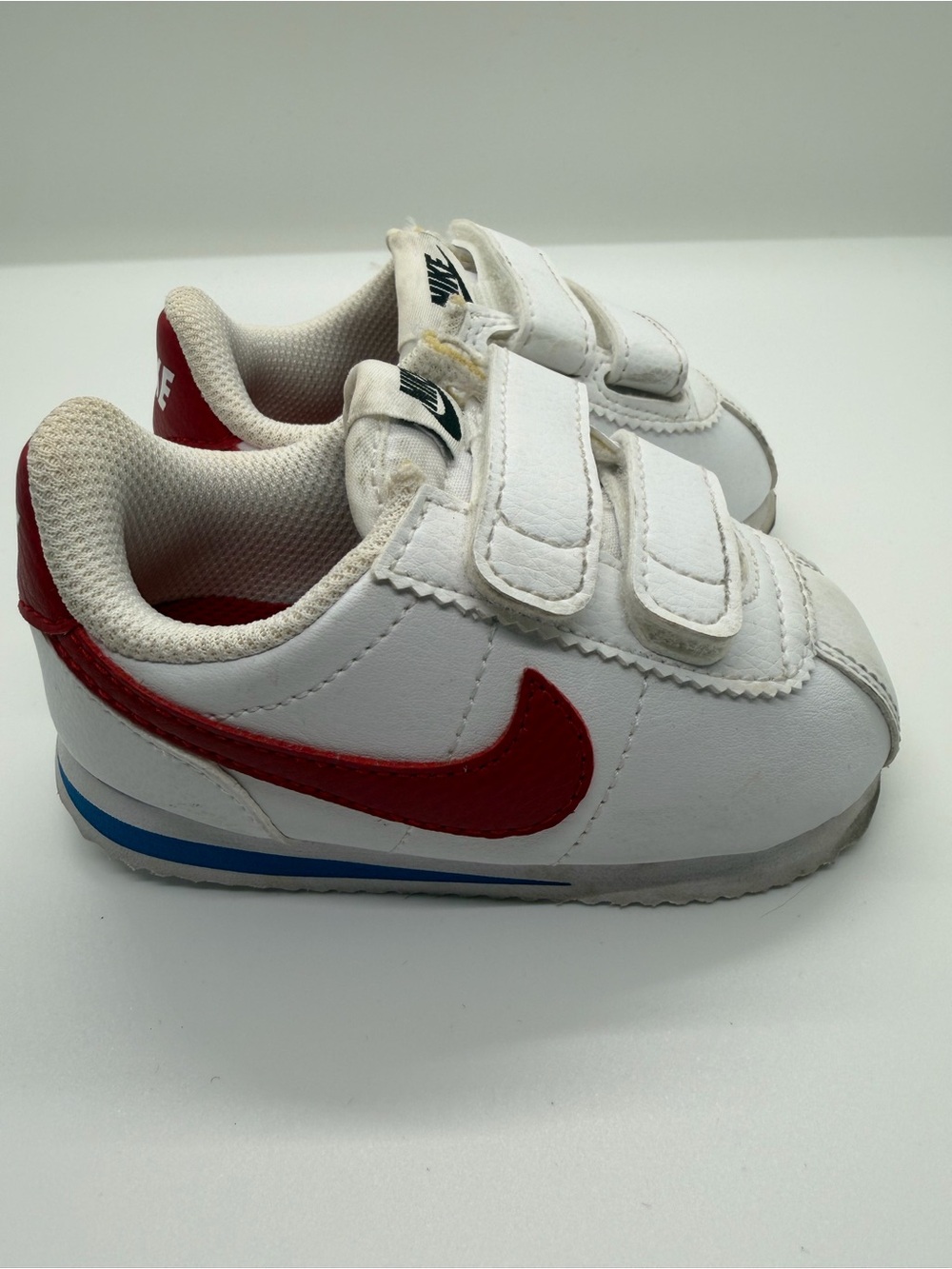 Nike Kids White Sneakers with Red Swoosh